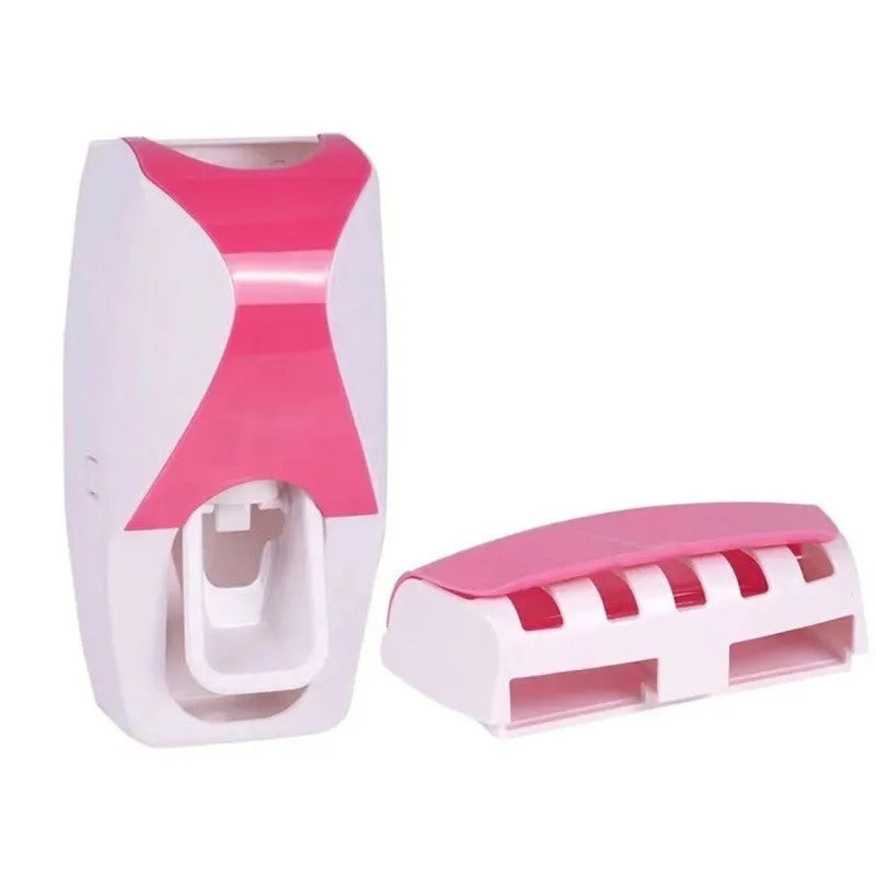 Automatic toothpaste dispenser with wall-mounted toothbrush holder in pink and white design for bathroom organization.